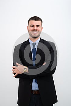 A businessman wearing a suit and Smiling young handsome caucasian man his arms crossed on white background