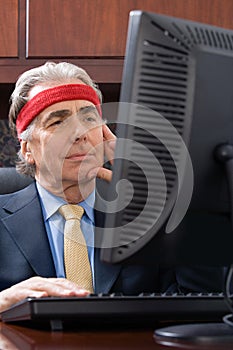 Businessman wearing a sweatband photo