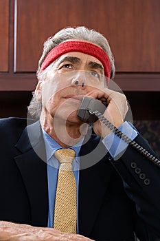 Businessman wearing a sweatband photo