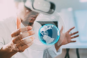 businessman wearing virtual reality goggles in modern office wit