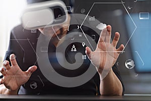 businessman wearing virtual reality goggles in modern office wit