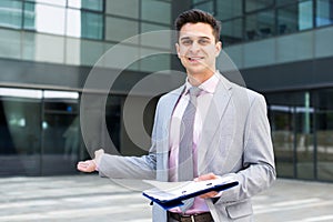 Businessman in welcoming gesture