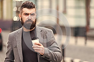 Businessman well groomed enjoy coffee break outdoor urban background. Thoughtful but relaxed. Walk and enjoy fresh hot