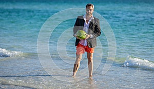 businessman in wet suit at the beach. Summer business dreams. Successful businessman on vacation. Businessman in suit