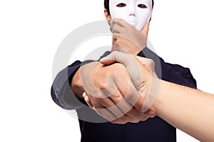 Businessman or white collar worker crime hold white mask. dishonest cheating person. Faking guy conceal face and hand shake to photo