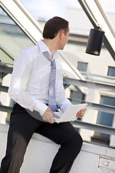 Businessman with white laptop computer