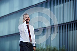 Businessman in a white shirt talking on the phone