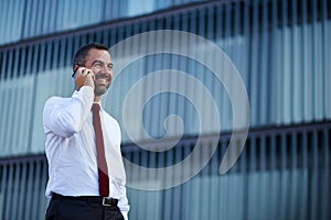 Businessman in a white shirt talking on the phone