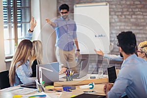 Businessman At Whiteboard Giving Presentation