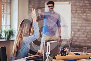 Businessman At Whiteboard Giving Presentation