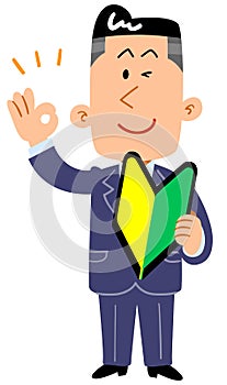 A businessman who has a beginner`s mark and issues an OK sign