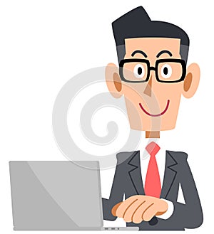 A Businessman who wear glasses to operate a computer