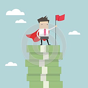 Businessman with winners flag standing on money stairs.