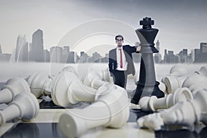 Businessman Winning Chess Game