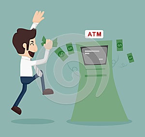 Businessman withdrawing money from ATM photo