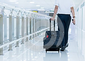 businessman wolking on walkway in airport.Businessman going abroad for meeting and business deal. After meeting he will