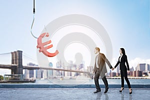 Businessman and woman with euro sign