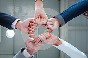 Businessman and woman putting hands first join together, business partnership colleagues holding hands as commitment of strong