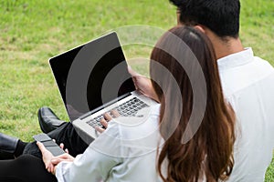 Businessman and woman on white shirt use laptop and smartphone i