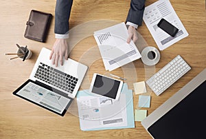 Businessman at work checking financial reports