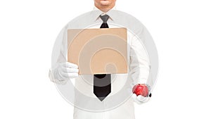 Businessman in work gloves with tie holds cardboard poster protesting unemployment.