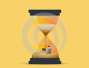 Businessman work inside a sand clock or hourglass representing deadline. productivity and time management concept