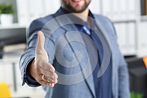 Businessman work in office lend hand ahead closeup