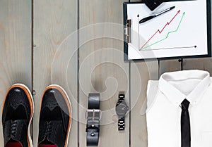 Businessman, work outfit on grey wooden background