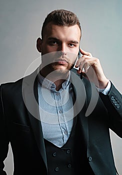 Businessman in work with phone mobil. Classic suits. Man suit fashion. Meeting phone.