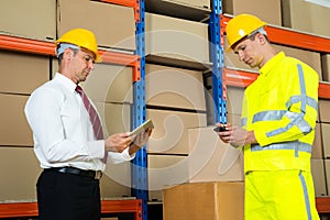 Businessman And Worker With Digital Tablet And Mobile Phone
