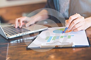 Businessman working on analysis charts and graphs showing result