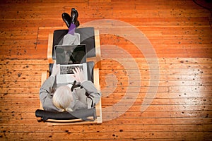 Businessman working on armchair