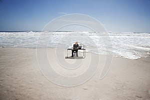 Businessman Working On Beach