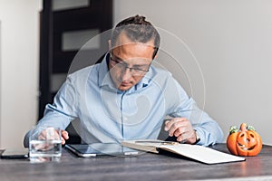 Businessman working, businessman in office, businessman looking at documents