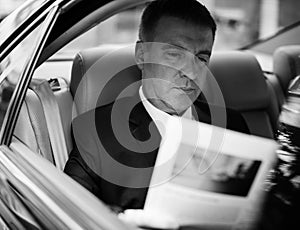 Businessman Working Busy Car Inside