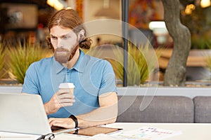 Businessman working in cafe