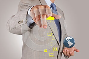 Businessman working with a Cloud Computing diagram on the new co