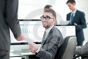 Businessman working on a computer on business reports