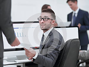 Businessman working on a computer on business reports
