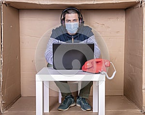 Businessman working in a cramped office, minimizing space