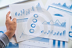Businessman working data document graph chart report marketing research development  planning management strategy analysis
