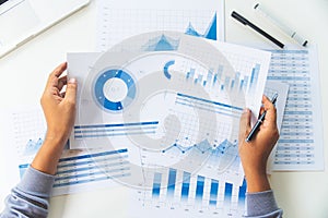 Businessman working data document graph chart report marketing research development  planning management strategy analysis