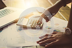 Businessman working on a desk numerical analysis, financial