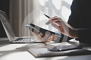 businessman working on desk office with using a calculator to calculate the numbers, finance accounting concept