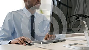 Businessman Working on Desktop Using Mouse and Keyboard