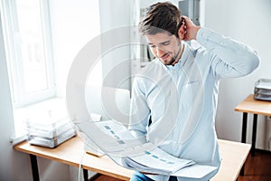 Businessman working with documents in folder