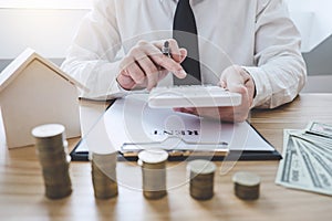 Businessman working doing finances and calculation cost of real