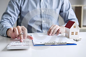 Businessman working doing finances and calculation cost of real