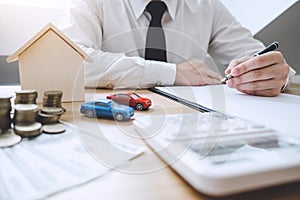 Businessman working doing finances and calculation cost of real