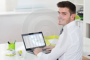 Businessman Working With Gantt Chart On Laptop